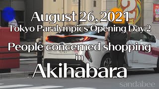 オリンピック車で行った秋葉原で買物楽しむオリパラ関係者。Olympic or Paralympic concerned enjoying shopping in Akihabara.